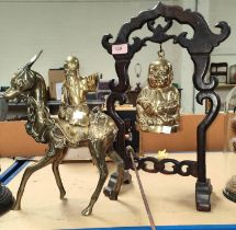 An oriental hardwood table gong with Buddha bell; an oriental brass group:  sage on a deer
