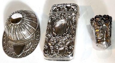 A hallmarked silver novelty caddy spoon in the form of a jockey's cap, Sheffield; a rococo