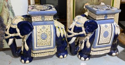 A modern pair of ceramic elephant stools