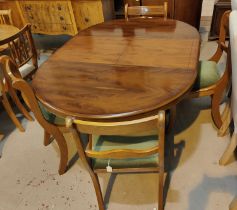 A Regency style yew wood dining suite comprising circular extending table on pedestal, and 4