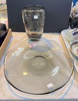 A SMOKED GLASS dish of heavy lobed form, engraved mark, 30cm, a similar vase with bubble inclusions,