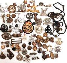 A collection of military badges, cap and others.