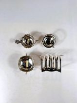 Three pieces of hallmarked silver:  a 4-division toast rack, Birmingham 1940; a small pedestal bowl,