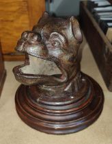 A cast metal French throwing game, bulldog with open mouth, mounted on wooden base