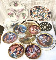 A set of 6 collectors plates:  James Bond; 3 cheese plates in original boxes; a large trefoil hors