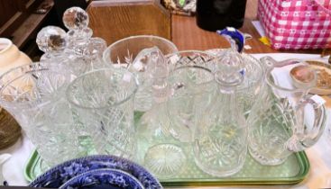 A selection of cut glass: decanters; vases; bowls