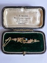 An Victorian 18ct gold seed pearl and turquoise bar brooch in original box, 3.2gms