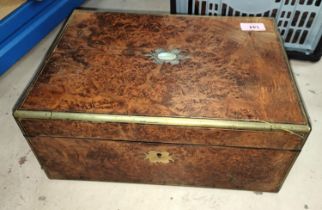 A 19th century burr walnut and brass bound writing desk with leather interior surface, ink wells,