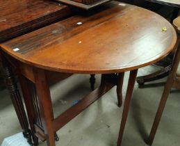 An Edwardian oval walnut Sutherland table on square splay legs