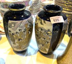 An early 20th century pair of satsuma baluster vases decorated with traditionally dressed ladies
