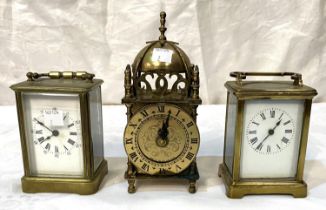 Two late 19th century brass carriage clocks; a reproduction lantern clock