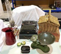 A vintage Remington portable typewriter, sewing baskets etc