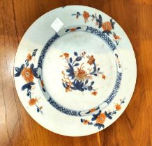 A 19th century blue & white plate decorated with a tree and flowers, diameter 23cm; an oriental