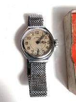 A mid century gent's Ingersoll wristwatch in stainless steel, with original warranty and box top