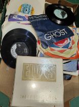 Elvis e.p. collection, white slip case edition and a good selection of similar singles.