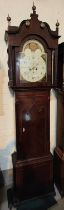 An early 19th century mahogany longcase clock by Thomas Barry, Bolton, the hood with brass finials