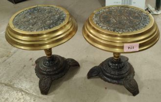 An Unusual pair of Victorian cast iron trivet stands with brass rims, Chinese influence, on three