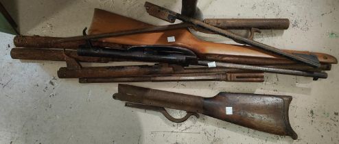 A collection of air rifle parts