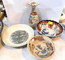 Four items of Japanese porcelain, a dish, two bowls and a vase