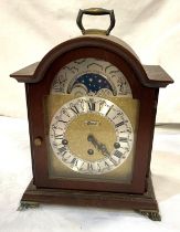 A reproduction Georgian style bracket clock in mahogany arch top case, with silvered and brass dial,