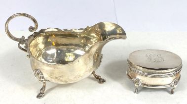 A hallmarked silver sauce boat in the Georgian style, Chester 1906; a hallmarked silver small oval