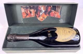 A bottle of Dom Perignon vintage 1998 in a green box.