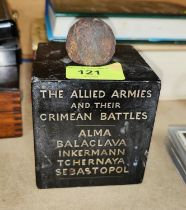 A marble cube commemorating the Allied Armies Crimean Battles surmounted by small cannon ball