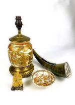 A Middle Eastern horn mounted in white metal mounts, (tests as silver) with etched decoration,