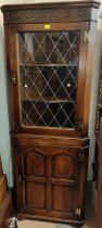 A Titchmarsh & Goodwin period style distressed oak full height corner cupboard with leaded glass