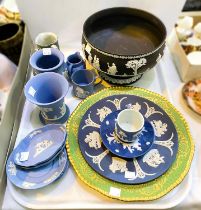 A signed hand painted Coalport plate, countryside with castle in the background, a Wedgwood black