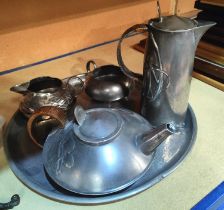 A four piece Liberties Tudric pewter tea service with teapot, hot water jug, milk and sugar No 0231,