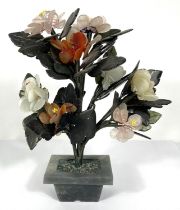 A Chinese polished hardstone table decoration with floral sprays, 22cm
