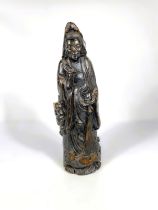 A Chinese carved bamboo figure of Guanyin with attendant Foo Lion, 37cm