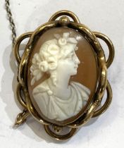 An oval female head cameo in an ornate gilt metal surround (pin missing); a white metal bar brooch