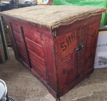 A stained pine hinged lidded bedding box