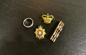 A yellow metal Edwardian three bar brooch set with seed pearls 4.7gm, two badges, a crown and a