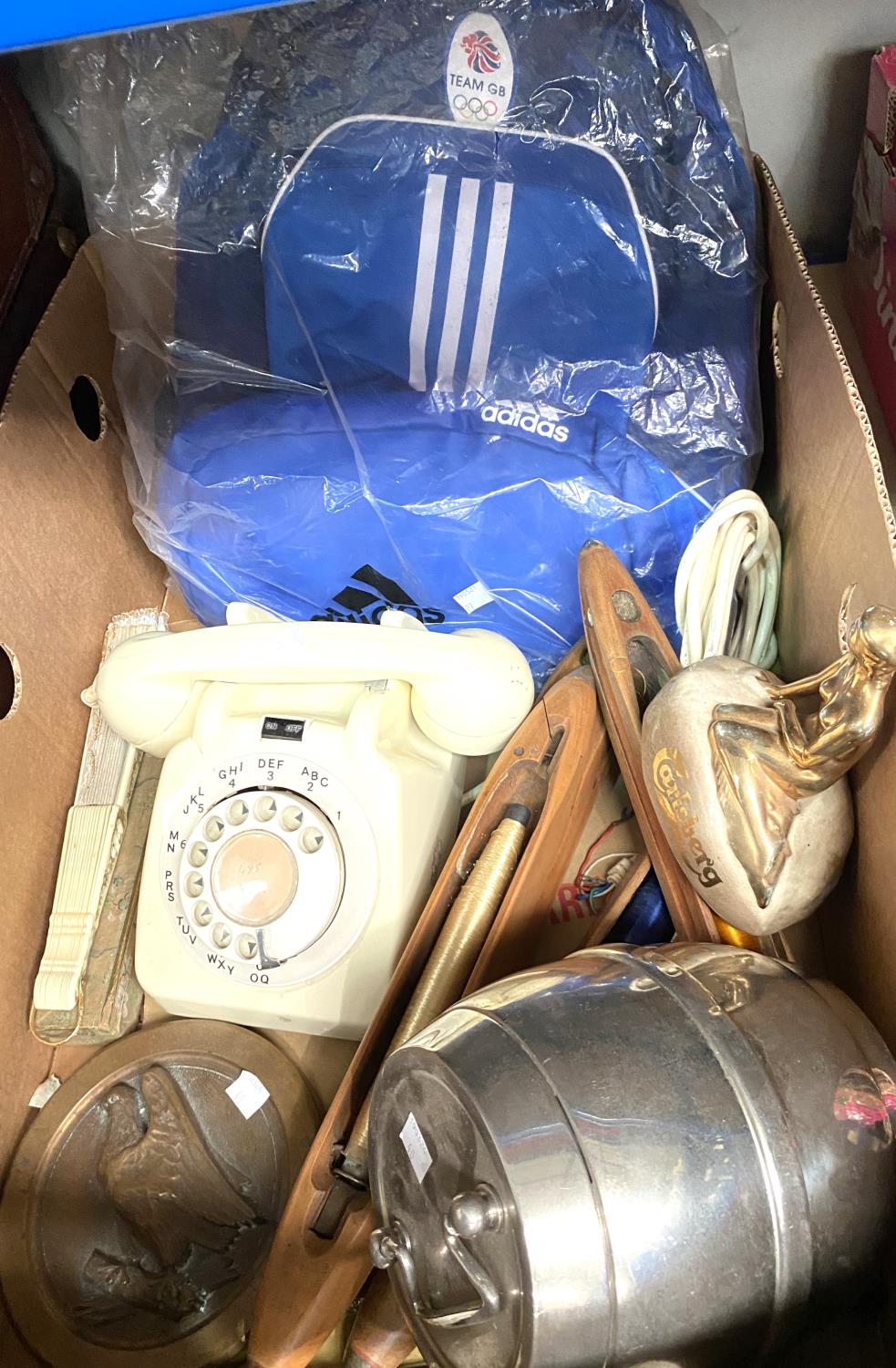 A brass roundell with hawk on branch, a vintage telephone and other collectables