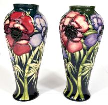 Moorcroft: A pair of Moorcroft anemone vases, graduating blue to green ground, ht. 20cm