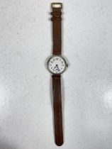 A silver cased officers style trench watch on leather strap
