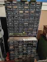 A large two height unit of industrial drawers with a large quantity of small drawers for