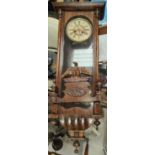 An early 20th century Vienna wall clock and two Napoleon cased mantel clocks