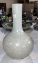 A Chinese crackle glaze bottle shaped vase in white, ht. 27cm, seal mark to base