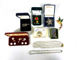 An early 20th century violin brooch set with paste stones, another mid century diamante brooch,