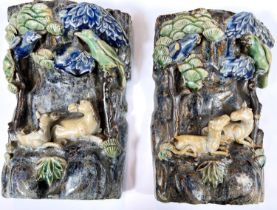 A pair of Chinese Shiuan wall pocket vases, relief decoration of horses and birds, ht. 21.5cm (