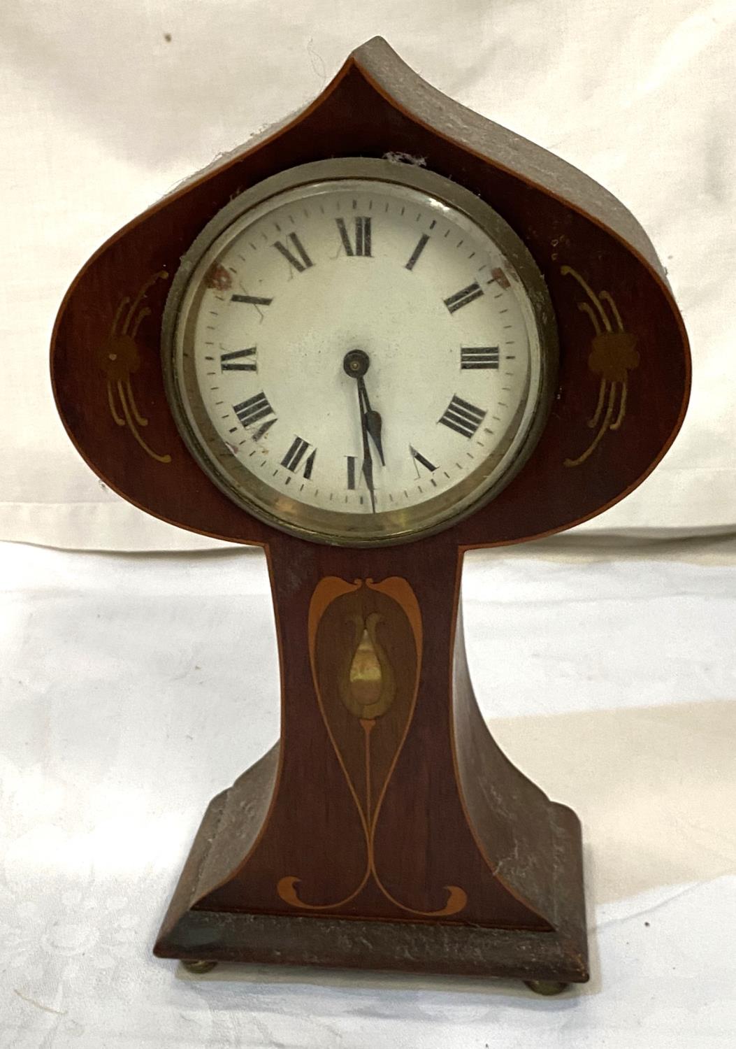 An Edwardian mantel clock with drum movement in mahogany balloon shaped case, Art Nouveau inlay (