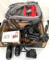 A Cannon E05 100D Digital SLR Camera; a Cannon lense 200m 75-300 mm; 18-55m lense; tripod;