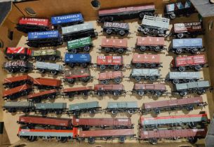 Forty items of rolling stock trucks/cars, some with advertising decals, 00 gauge