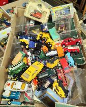 A collection of boxed and loose diecast vehicles, games compendiums etc