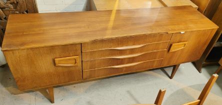A mid 20th century teak sideboard with cupboard to each end and three central drawers, length 183cm,