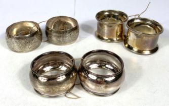 Three pairs of hallmarked silver napkin rings, various dates, 2.5gm
